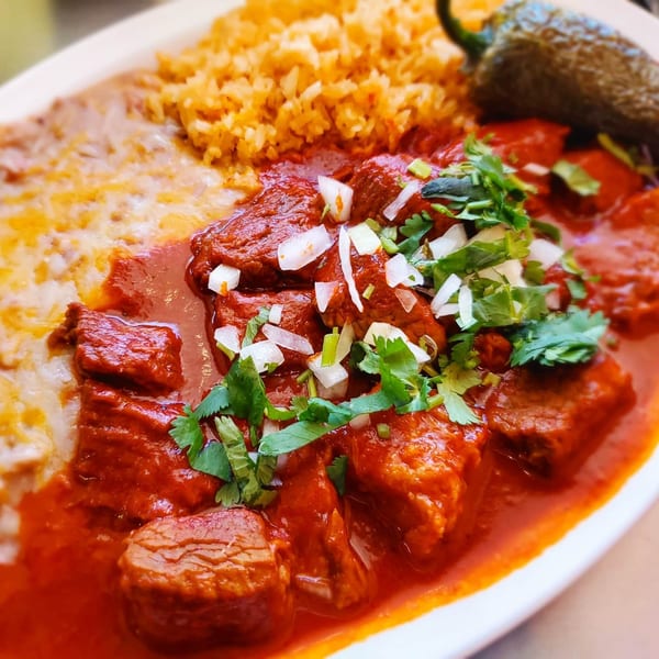 Las Salsas Taqueria's chile colorado with rice, refried beans, and a whole serrano pepper.